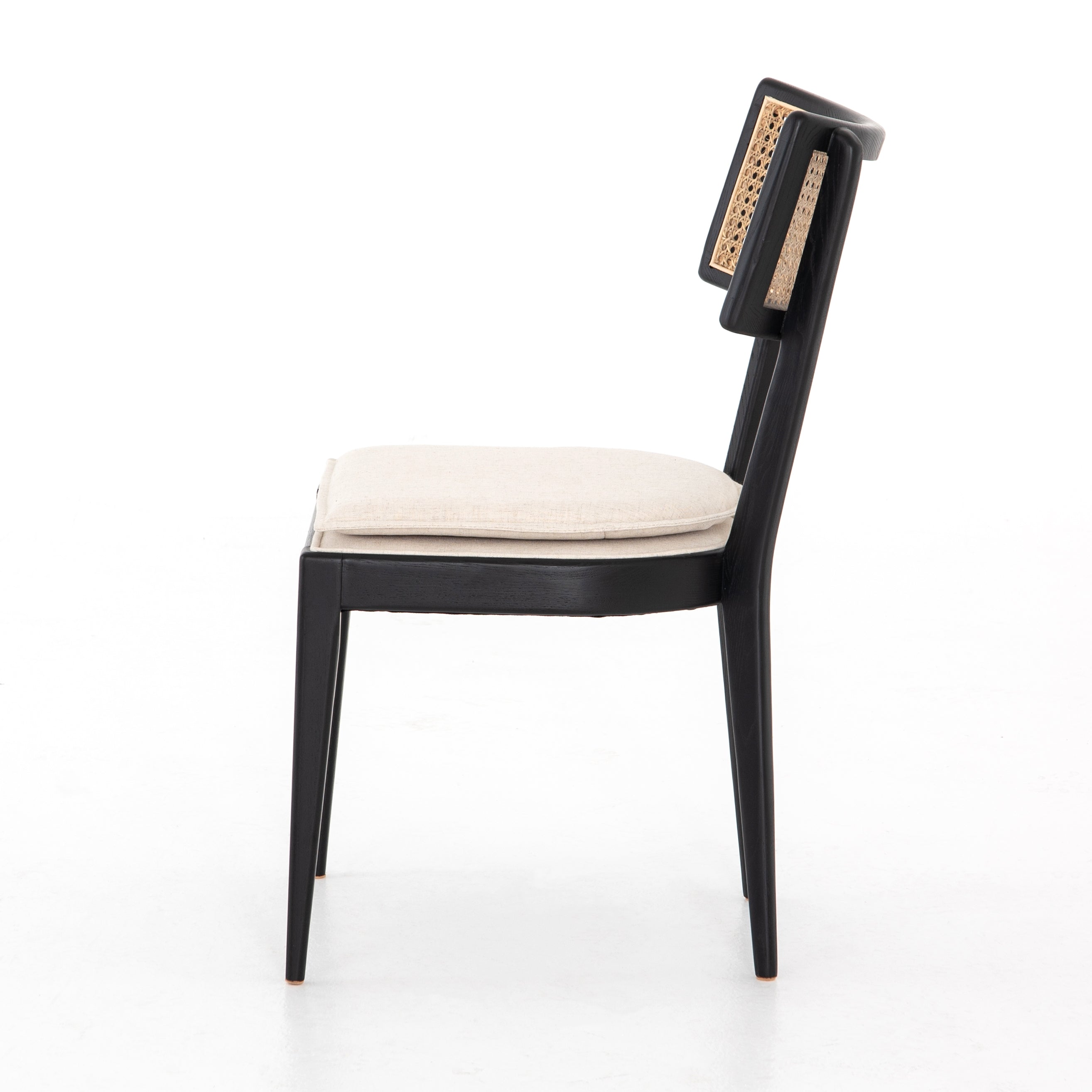 Featuring Britt Brushed Ebony Dining Chair by Four Hands at Amethyst Home. Mixed materials refresh retro dining style. Ebony-finished nettlewood frames a textural inlay of natural cane, for perfect contrast. Fastened by Velcro, high-performance linen-blend seating for modern sensibility. Performance fabrics are specially created to withstand spills, stains, high traffic and wear, en. Amethyst Home provides interior design, new construction, custom furniture and area rugs in the Portland metro area