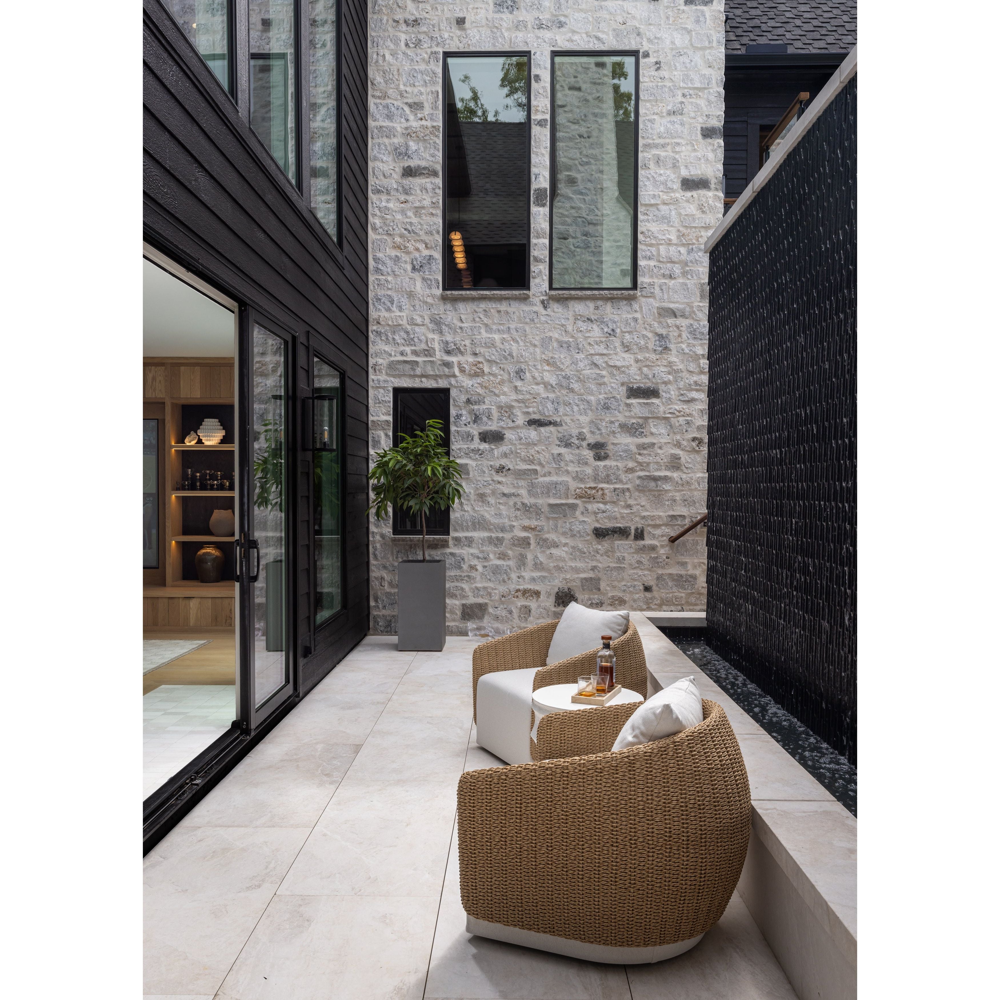 Featuring Maven Alessi Linen Outdoor Swivel Chair by Four Hands at Amethyst Home. Sustainably made with zero waste, luxurious Italian upholstery places a new and unique spin on indoor/outdoor seating, offering soft, durable fabric that's highly resistant to sun, stains, mold and abrasion. Shell framing of faux hyacinth weaves for extra texture atop a 36. Amethyst Home provides interior design, new home construction design consulting, vintage area rugs, and lighting in the Newport Beach metro area.