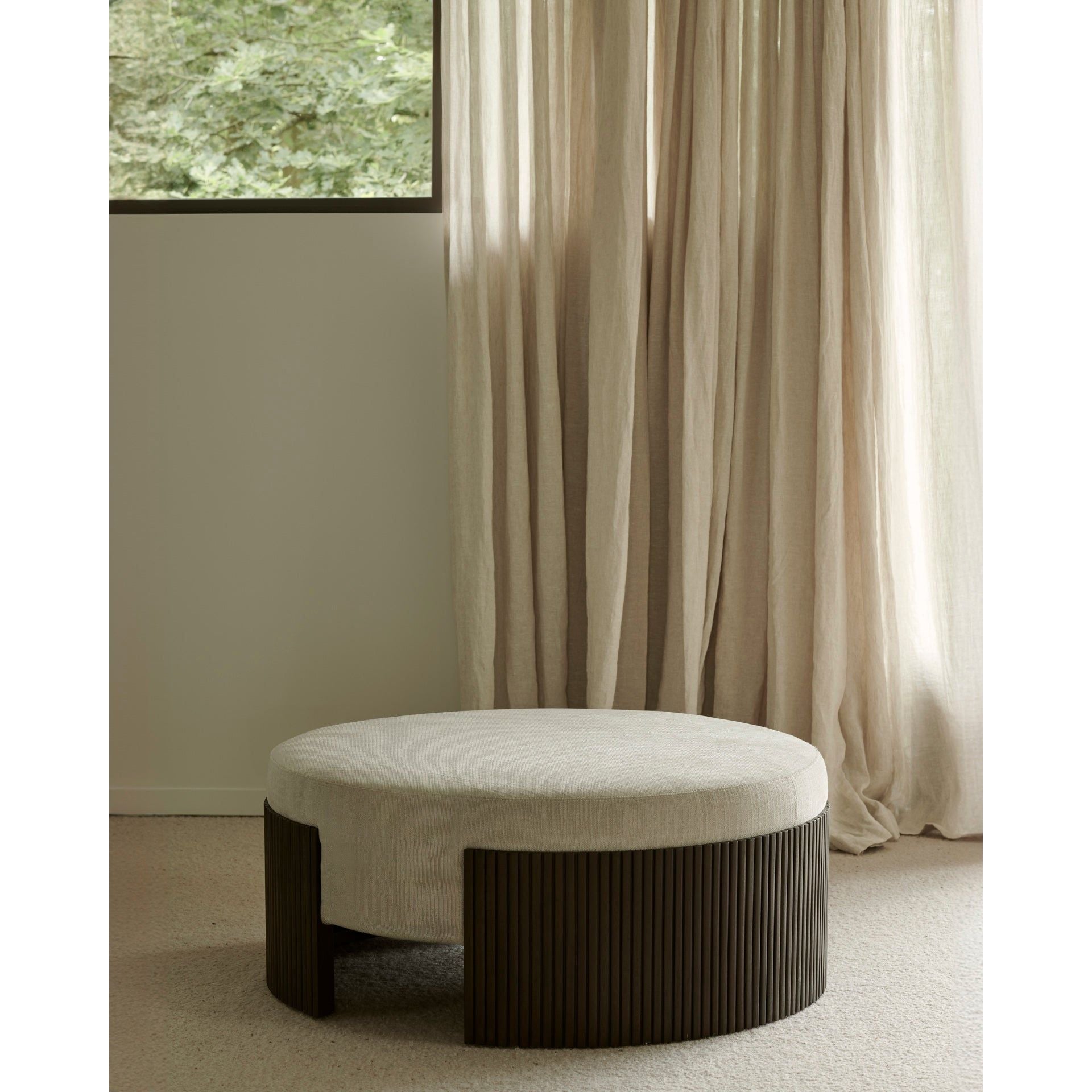 Featuring Roller Mahogany Dark Brown Max Pouf by Ethnicraft at Amethyst Home. The Roller Max collection is remarkable in its design, distinguished with its stacked wood-stick effect. The pouf is a multifunctional item which encapsulates the comfortable upholstery cushion within the dark brown-varnished mahogany.Weight : 37 lbs Dimensions: 33.5" W x 33.5" L x .  Amethyst Home provides interior design, new home construction design consulting, vintage area rugs, and lighting in the Dallas metro area.