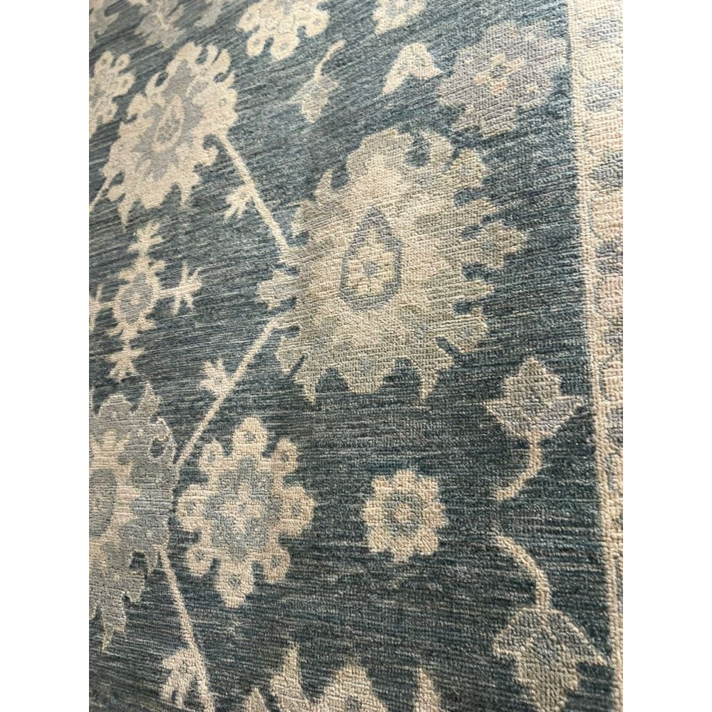 Featuring Orenda Kerensa Hand-Knotted Rug by Jaipur Living at Amethyst Home. The Orenda Kerensa features heirloom-quality designs of muted and uniquely updated Old World patterns. The Kerensa area rug boasts a beautifully washed medallion motif with an antique Oushak-inspired vibe. The cream tone is accented with cool blues, greens, and warm beige hues fo.  Amethyst Home provides interior design, new home construction design consulting, vintage area rugs, and lighting in the Washington metro area.