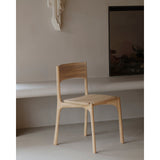 Featuring Pi Armless Oak Dining Chair by Ethnicraft at Amethyst Home. The PI collection honors nature’s design by keeping the strength, curves and lines, as nature intended. Interesting shapes are discovered in this sleek and stylish, polished imperfect, finish. Each PI item is finished by hand to ensure that the individual character of the wood is respec.  Amethyst Home provides interior design, new home construction design consulting, vintage area rugs, and lighting in the Washington metro area.