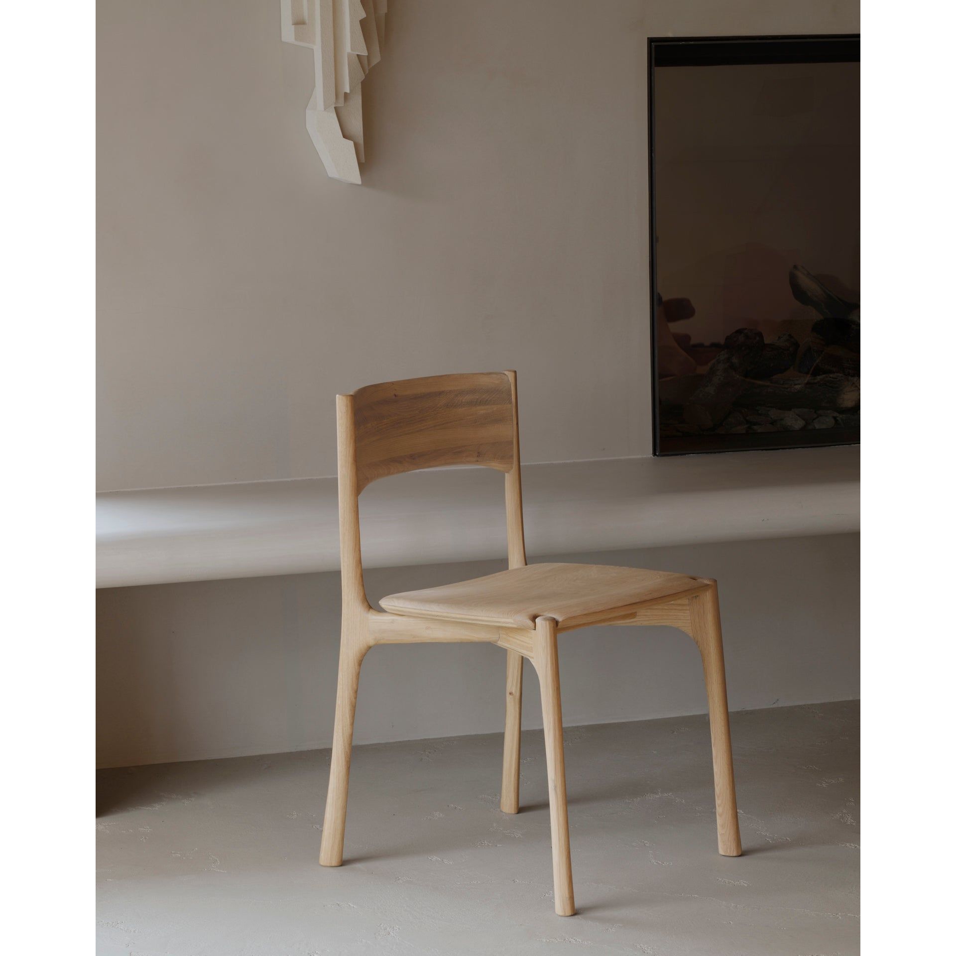 Featuring Pi Armless Oak Dining Chair by Ethnicraft at Amethyst Home. The PI collection honors nature’s design by keeping the strength, curves and lines, as nature intended. Interesting shapes are discovered in this sleek and stylish, polished imperfect, finish. Each PI item is finished by hand to ensure that the individual character of the wood is respec.  Amethyst Home provides interior design, new home construction design consulting, vintage area rugs, and lighting in the Washington metro area.