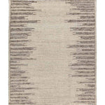Featuring Alpine Patra Hand-Knotted Rug by Jaipur Living at Amethyst Home. Inspired by textiles from the Tullu region in Morocco, the Patra area rug showcases a linear design in neutral shades of cream, taupe, brown, and gray. This high-piled accent lends warmth and comfort to any space with durable wool hand-knotted onto a cotton foundation. Braided fring. Amethyst Home provides interior design, new home construction design consulting, vintage area rugs, and lighting in the Washington metro area.