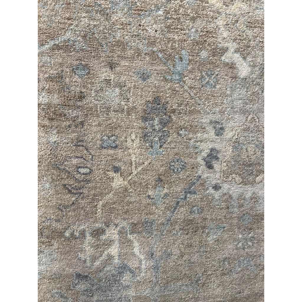 Featuring Orenda Rivera Rug by Jaipur Living at Amethyst Home. The Orenda collection features heirloom-quality designs of muted and uniquely updated Old World patterns. The Rivera area rug boasts a beautiful Oriental motif with abstract floral details. The taupe, blue, cream, and gray tones are grounding and neutral, perfect for providing an inviting an.  Amethyst Home provides interior design, new home construction design consulting, vintage area rugs, and lighting in the Laguna Beach metro area.