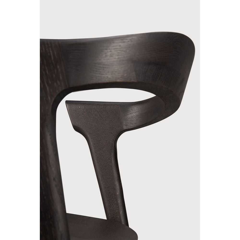 Over the years, the Bok dining chair has become one of our most recognisable designs. Designer Alain van Havre combines sculptural elegance and contemporary crafting into a graceful and airy form.
Seating height: 46cm - 18".
Made from brown tainted oak with a varnish finish. Amethyst Home provides interior design, new construction, custom furniture, and area rugs in the Omaha metro area