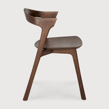Featuring Bok No Upholstery Varnished Teak Brown Dining Chair by Ethnicraft at Amethyst Home. Reminiscent of a goat's curved horns, the Bok collection combines sculptural elegance and contemporary crafting into a graceful and airy form. Over the years, the Bok dining chair has become one of Ethnicraft's most recognisable designs.Weight : 33 lb Dimensions: 24.5 in W x 23 in L x 35 . Amethyst Home provides interior design, new construction, custom furniture, and area rugs in the Park City metro area