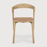 Featuring Bok Sienna Leather Varnished Oak Dining Chair by Ethnicraft at Amethyst Home. Reminiscent of a goat's curved horns, the Bok collection combines sculptural elegance and contemporary crafting into a graceful and airy form. Over the years, the Bok dining chair has become one of Ethnicraft's most recognisable designs.Weight : 15 lbs Dimensions: 21.5" W x 20" L x 30" H. Amethyst Home provides interior design, new construction, custom furniture, and area rugs in the Houston metro area