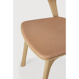 Featuring Bok Sienna Leather Varnished Oak Dining Chair by Ethnicraft at Amethyst Home. Reminiscent of a goat's curved horns, the Bok collection combines sculptural elegance and contemporary crafting into a graceful and airy form. Over the years, the Bok dining chair has become one of Ethnicraft's most recognisable designs.Weight : 15 lbs Dimensions: 21.5" W x 20" L x 30" H. Amethyst Home provides interior design, new construction, custom furniture, and area rugs in the Portland metro area