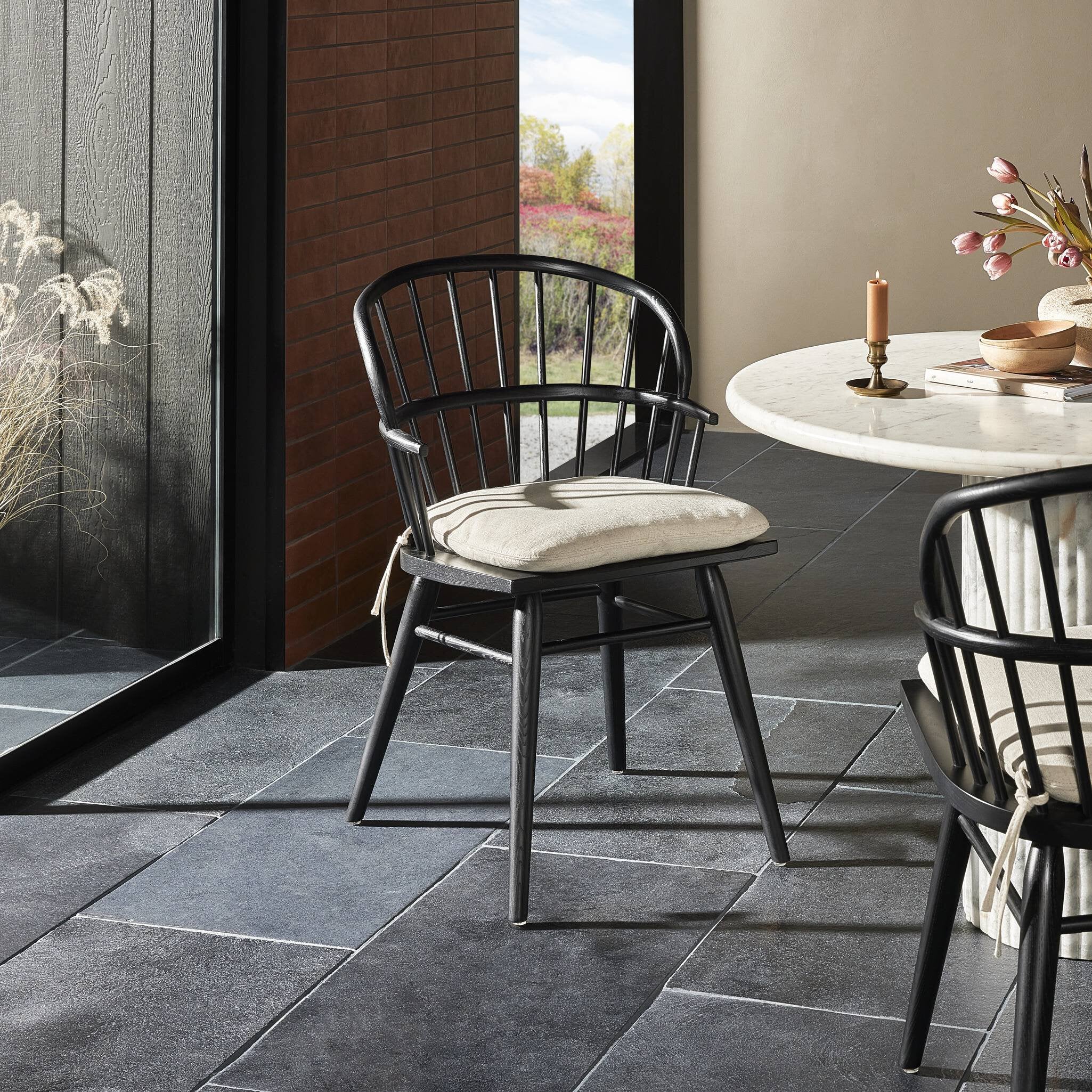 Featuring Connor Savile Flax Dining Chair by Four Hands at Amethyst Home. The classic Windsor, modernized. Seating of black-finished solid ash features a double-tiered back and finely sculpted frame.Overall Dimensions: 23.75"w x 24.50"d x 34.75"hWeight : 15.43 lbsMaterials : 92% Polyester, 8% Flax/Linen, Solid Ash. Amethyst Home provides interior design, new construction, custom furniture, and area rugs in the Laguna Beach metro area