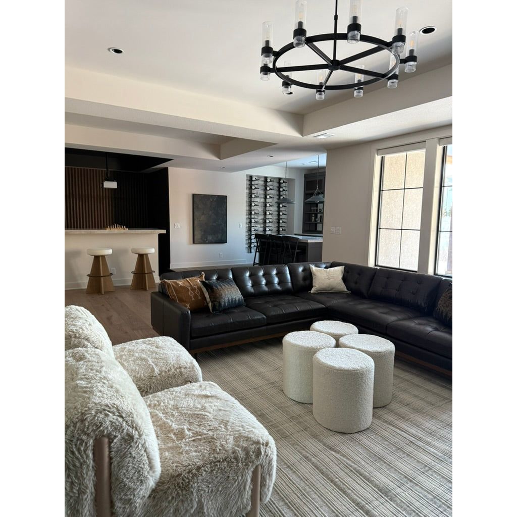 Featuring Folke Pipaluk Pouf by Jaipur Living at Amethyst Home. Cozy and stylish in the same moment, the Folke Pipaluk Pouf collection boasts the soft and inviting texture of the on-trend shearling look. Crafted of wool, the cylinder Micco pouf showcases boucle details and a light and airy design. The solid cream colorway offers a perfectly neutral palette to.  Amethyst Home provides interior design, new home construction design consulting, vintage area rugs, and lighting in the Boston metro area.