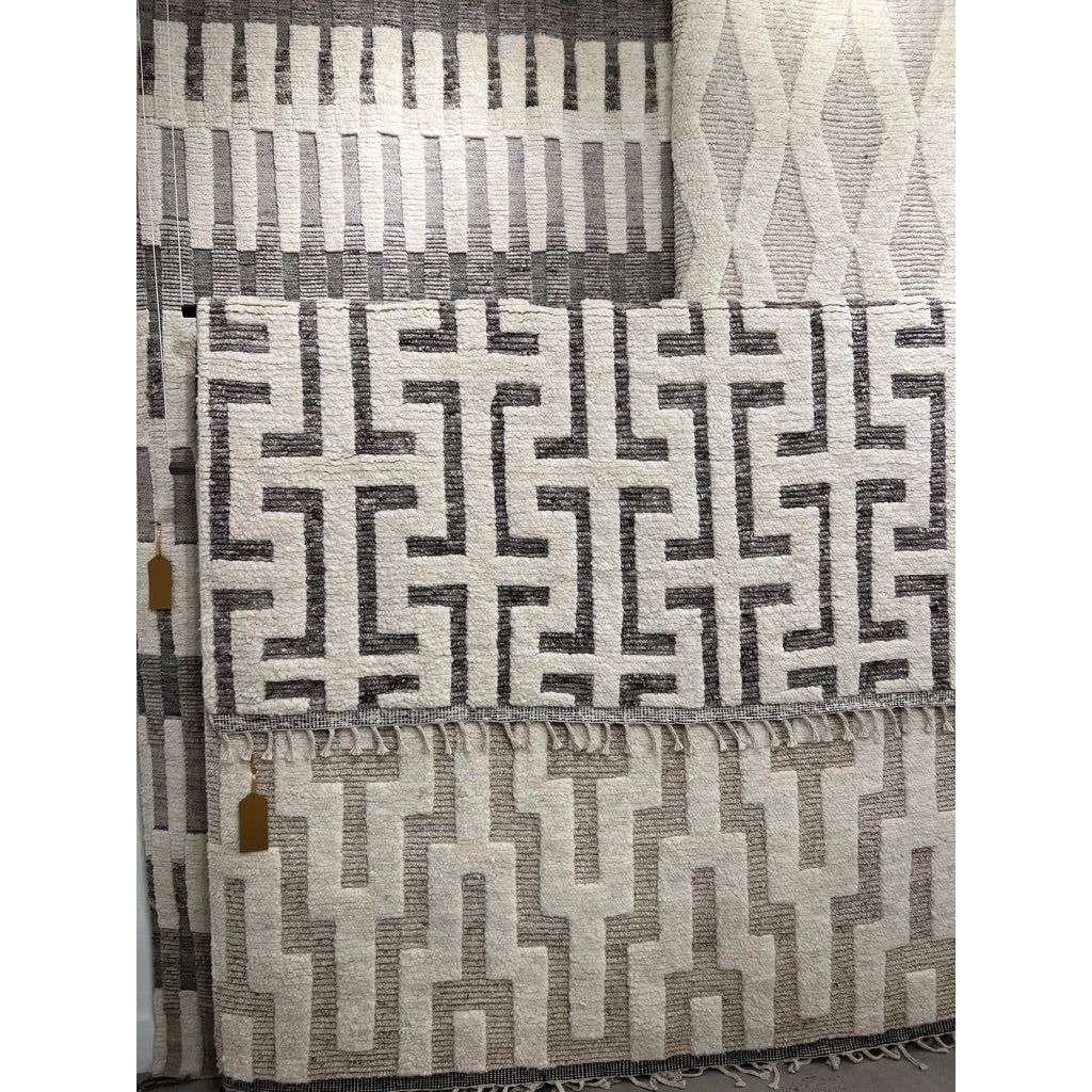 Featuring Keoka Semra Rug by Jaipur Living at Amethyst Home. The Keoka Semra Rug boasts a fresh take on classic Afghani hand-knotted textiles. In rich, grounding tones of gray and ivory, the stylish contrast of the rug anchors room with bold yet neutral appeal. The texture-rich wool pile features a ribbed construction that lends unique linear details to t.  Amethyst Home provides interior design, new home construction design consulting, vintage area rugs, and lighting in the Washington metro area.