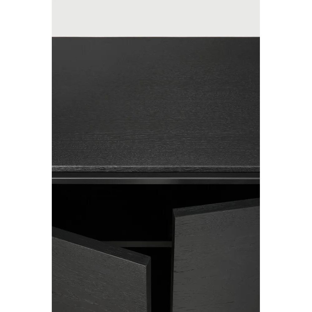 Featuring Monolit Sideboard by Ethnicraft at Amethyst Home. Practicality without sacrificing style. The contrasting characteristics of wood and the rectangular metal frame of the Monolit sideboard create a unique backdrop for all modern media equipment.
Dimensions: 20.5" L x 46" W x 33" H 
Adjustable Shelves : YesAnti-tipping mechanism : YesBrushed : This finis. Amethyst Home provides interior design, new home construction design consulting, vintage area rugs, and lighting in the Tampa metro area.