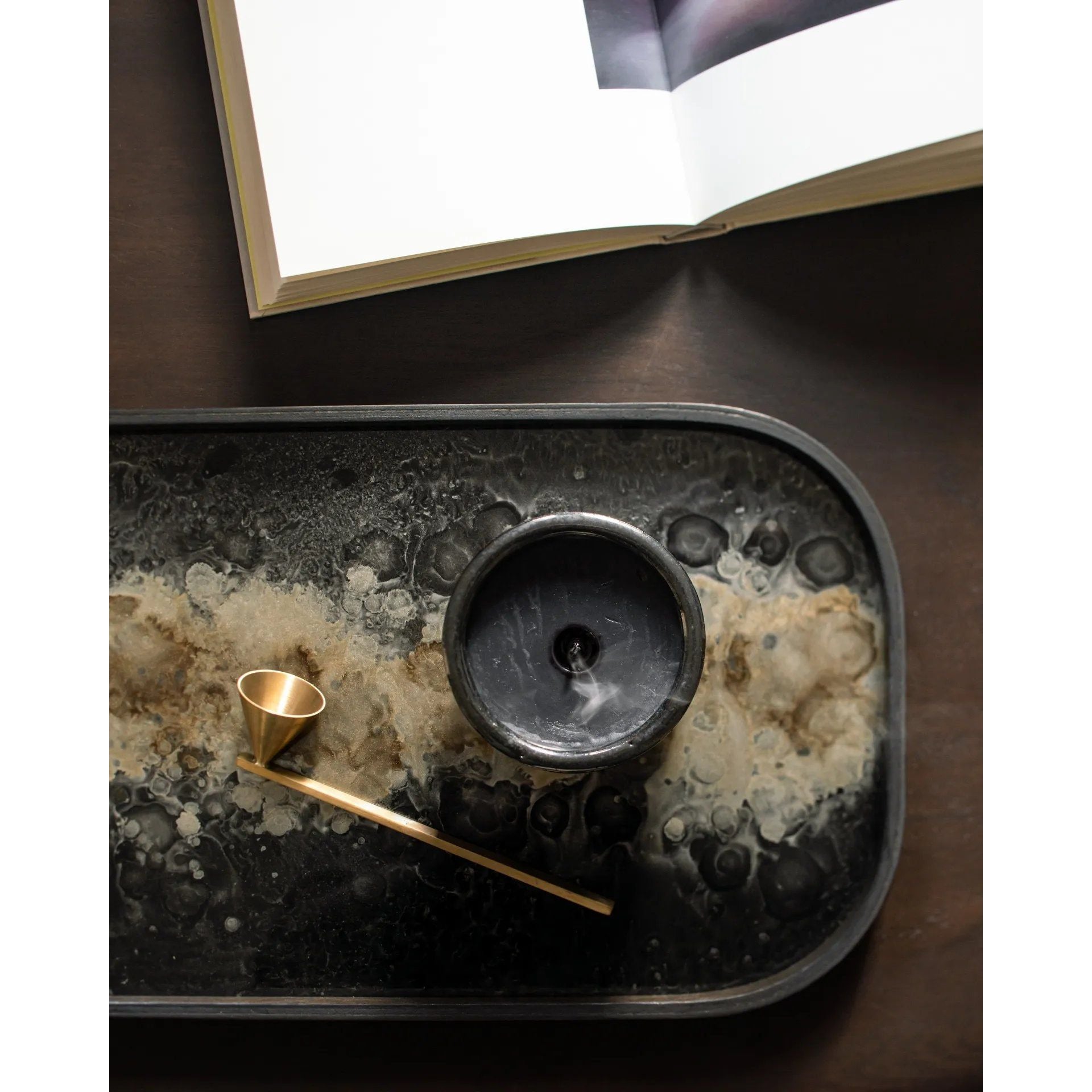 Featuring Organic Valet Tray by Ethnicraft at Amethyst Home. A subdued color palette meets captivating motifs inspired by nature and travel. This Black Organic glass valet tray experiments with the balance between rich patterns offset with muted tones, revealing the beauty behind the deceivingly ordinary subjects from which inspiration is drawn. In doing so, t. Amethyst Home provides interior design, new home construction design consulting, vintage area rugs, and lighting in the Boston metro area.