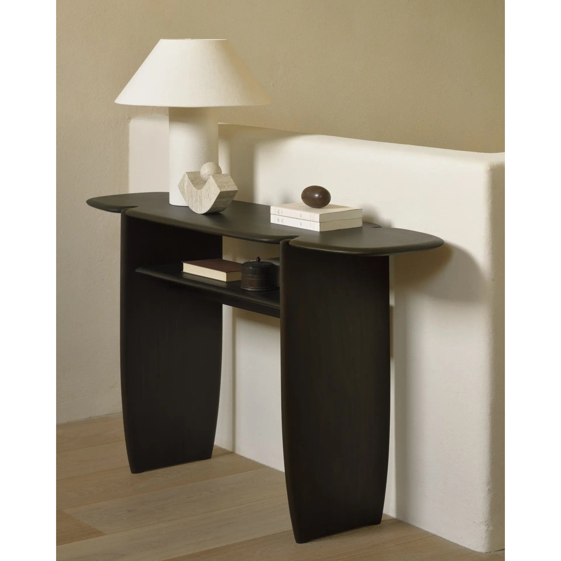 Featuring PI Console Mahogany Dark Brown by Ethnicraft at Amethyst Home. The PI collection honors nature’s design by keeping the strength, curves and lines, as nature intended. Interesting shapes are discovered in this sleek and stylish, polished imperfect finish. Each PI console is finished by hand to ensure that the individual character of the wood is res. Amethyst Home provides interior design, new home construction design consulting, vintage area rugs, and lighting in the San Diego metro area.