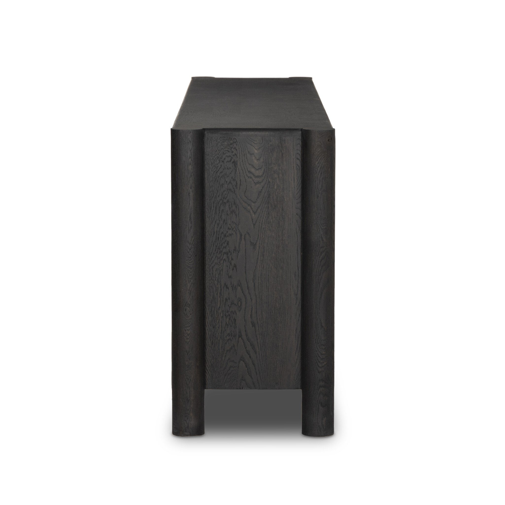 Featuring Ezri Black Oak Sideboard by Four Hands at Amethyst Home. Grain and character variation within a solid oak finish give this sideboard organic visual interest. The carved design and floor-to-top cylinder legs give a primitive look that balances the movement of the wood pattern.Overall Dimensions: 98.00"w x 18.00"d x 34.00"hWeight : 245.38 lbsMaterials : Solid Oak. Amethyst Home provides interior design, new construction, custom furniture, and area rugs in the Austin metro area