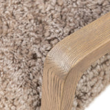 The perfect place to curl up with a good book. A hand-shaped parawood frame supports low, deep seating upholstered with taupe shearling Amethyst Home provides interior design, new home construction design consulting, vintage area rugs, and lighting in the Park City metro area.