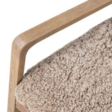 The perfect place to curl up with a good book. A hand-shaped parawood frame supports low, deep seating upholstered with taupe shearling Amethyst Home provides interior design, new home construction design consulting, vintage area rugs, and lighting in the Tampa metro area.