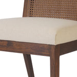 Mixed materials refresh a retro style. Cane frames performance fabric seating with slight distressing, bringing more character to the seat. Performance fabrics are specially created to withstand spills, stains, high traffic and wear, ensuring long-term comfort and unmatched durability. Amethyst Home provides interior design, new home construction design consulting, vintage area rugs, and lighting in the San Diego metro area.