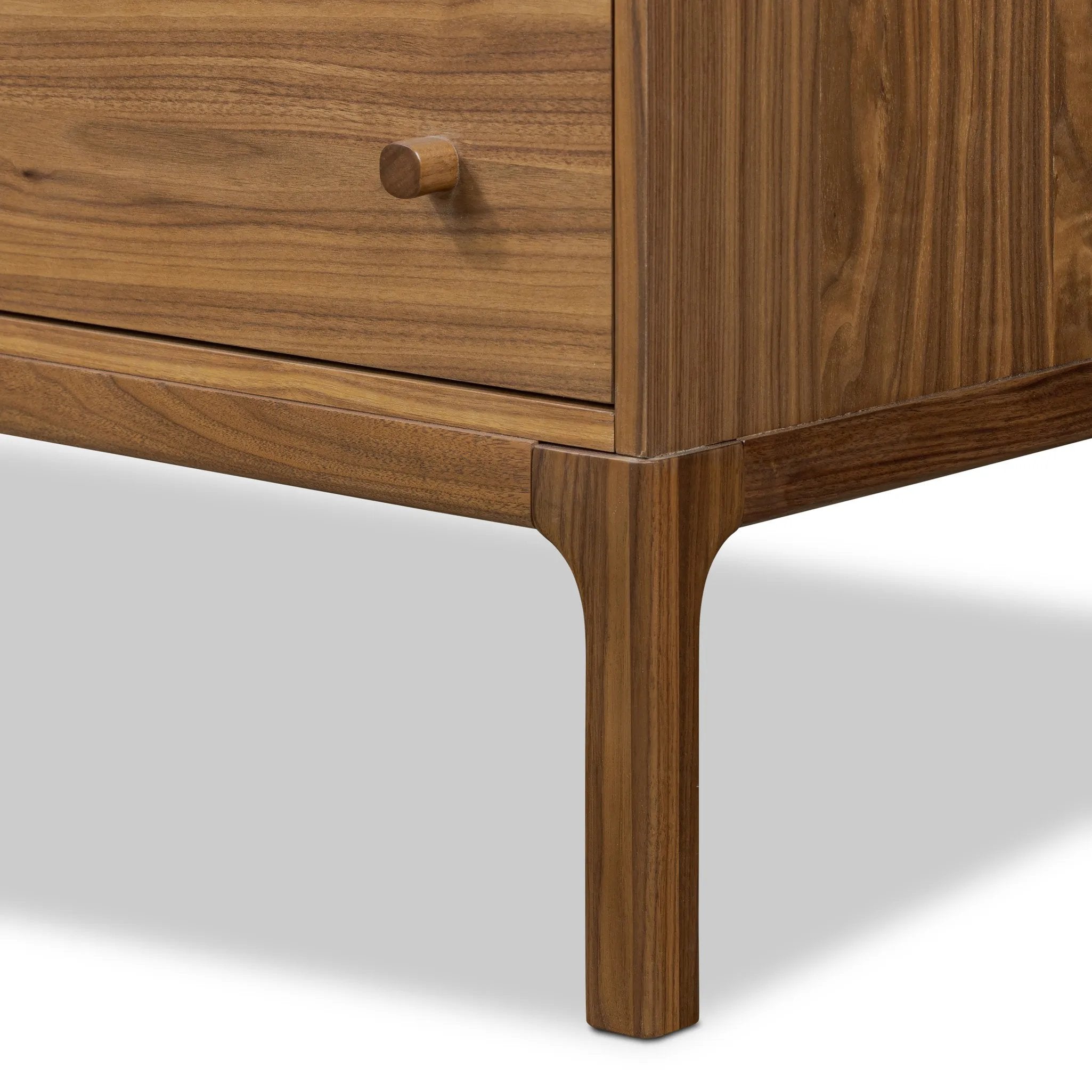 Featuring Arturo Natural Walnut Veneer 9 Drawer Dresser by Four Hands at Amethyst Home. Inspired by campaign-style furniture of the 1800s — packable pieces first designed for traveling military use — a simply shaped dresser of natural walnut features a subtly inset top and rounded legs, finished with wooden hardware. This item has been modified to comply with . Amethyst Home provides interior design, new home construction design consulting, vintage area rugs, and lighting in the Dallas metro area.