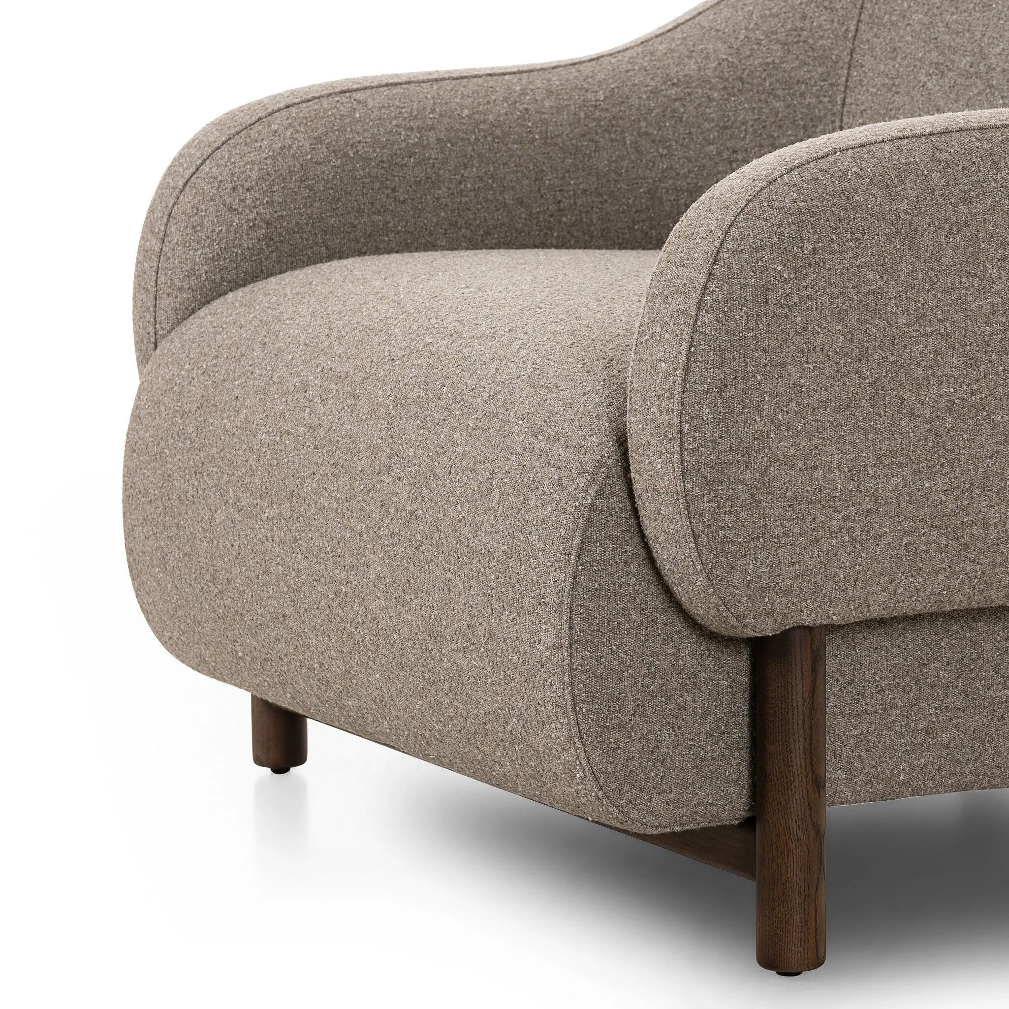 Featuring Audrey Weslie Feather Chair by Four Hands at Amethyst Home. This elevated arm chair features a clean top piece that partially overlaps its bottom counterpart and seamlessly blends the back cushion into the armrests in one fluid form. The seat's legs appear to extend from the seat and back, adding architectural interest. Upholstered in a recycled Turki. Amethyst Home provides interior design, new home construction design consulting, vintage area rugs, and lighting in the Tampa metro area.