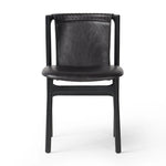 Featuring Baden Sonoma Black Dining Chair by Four Hands at Amethyst Home. Midcentury-inspired with its minimalist wooden frame, this armless dining chair features a low back and float-like seat upholstered in slightly distressed black top-grain leather exclusive to Four Hands. Leather wrap detailing for texture.Overall Dimensions: 19.75"w x 23.25"d x 32.25". Amethyst Home provides interior design, new home construction design consulting, vintage area rugs, and lighting in the Charlotte metro area.
