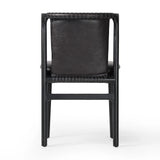Featuring Baden Sonoma Black Dining Chair by Four Hands at Amethyst Home. Midcentury-inspired with its minimalist wooden frame, this armless dining chair features a low back and float-like seat upholstered in slightly distressed black top-grain leather exclusive to Four Hands. Leather wrap detailing for texture.Overall Dimensions: 19.75"w x 23.25"d x 32.25". Amethyst Home provides interior design, new home construction design consulting, vintage area rugs, and lighting in the San Diego metro area.