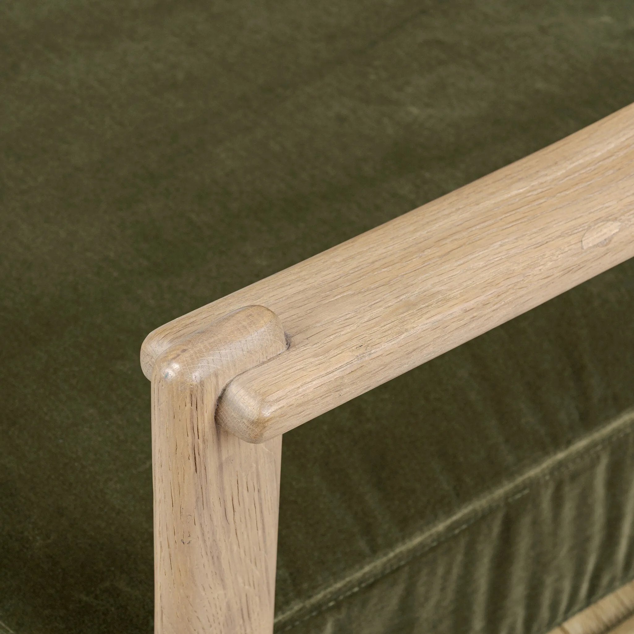 Tapered legs and sloped paddle arms frame the visible joinery and handwoven rope details of this accent chair, for a monochromatic yet visually intriguing frame. Finished with loose, velvet-upholstered seat and back cushions in a rich olive hue — for a subtle color contrast that celebrates the natural beauty of each material Amethyst Home provides interior design, new home construction design consulting, vintage area rugs, and lighting in the Austin metro area.