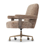 A large, comfort-driven desk chair of taupe shearling tops a 360-degree swivel, for a luxurious take on office styling Amethyst Home provides interior design, new home construction design consulting, vintage area rugs, and lighting in the Kansas City metro area.