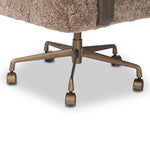 A large, comfort-driven desk chair of taupe shearling tops a 360-degree swivel, for a luxurious take on office styling Amethyst Home provides interior design, new home construction design consulting, vintage area rugs, and lighting in the Nashville metro area.