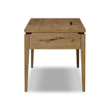 Featuring Bergstrom Warm Natural Oak Veneer Desk by Four Hands at Amethyst Home. Warm up your workspace with this light-finished writing desk of rich character oak. Tapered legs and subtle corner relief details create a simplified look that complements a home office or flex space. Complete with thoughtful touches like built-in cord management, a flip-top outlet. Amethyst Home provides interior design, new home construction design consulting, vintage area rugs, and lighting in the Tampa metro area.