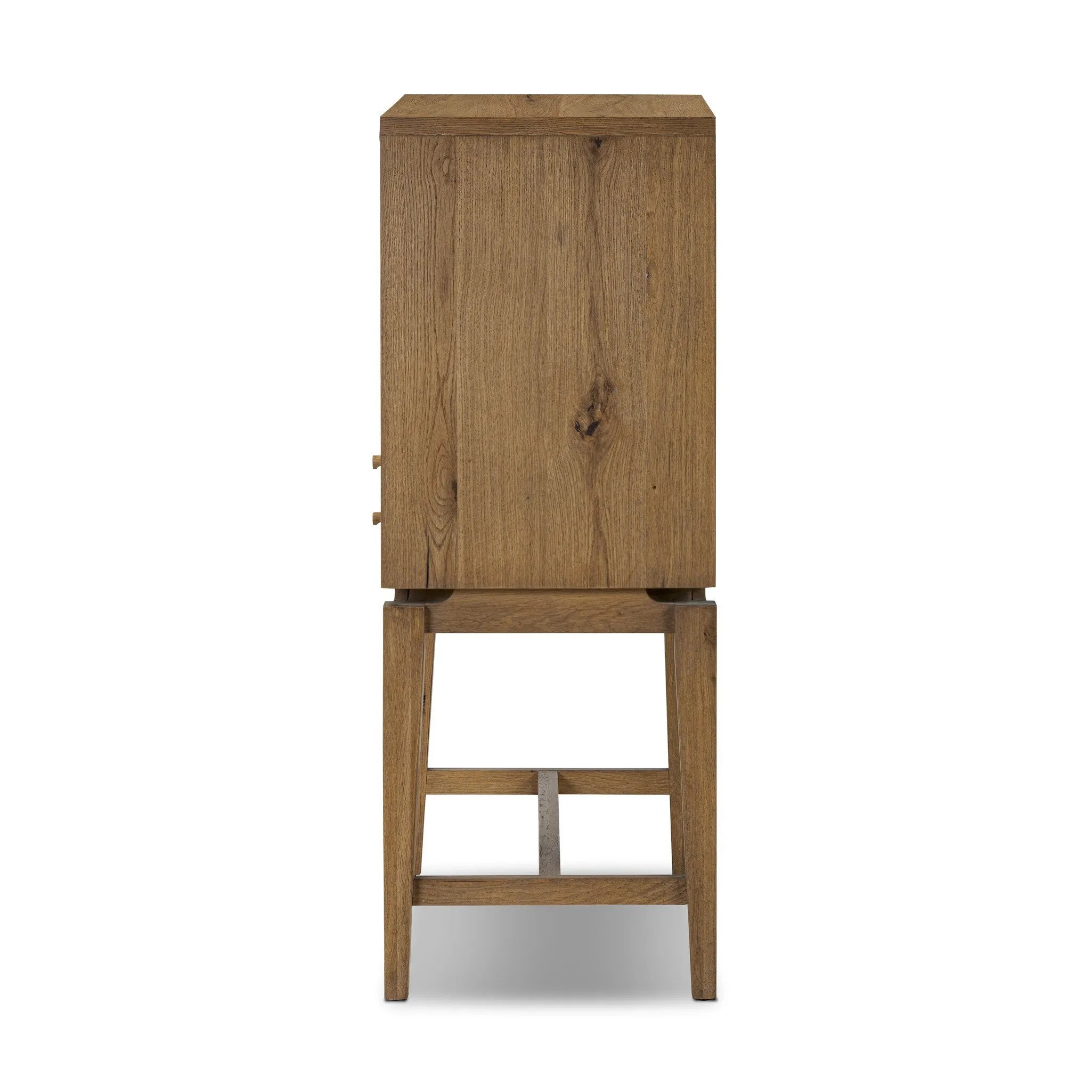 Featuring Bergstrom Warm Natural Oak Veneer Secretary Desk by Four Hands at Amethyst Home. A fresh take on the traditional secretary desk, made from warm natural oak. A flip-down top creates a wide writing surface, offering the perfect place to pen a handwritten note. Overall Dimensions: 35.00"w x 18.00"d x 48.00"h. Amethyst Home provides interior design, new home construction design consulting, vintage area rugs, and lighting in the Dallas metro area.