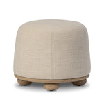Featuring Bilbury Saxon Sand Ottoman by Four Hands at Amethyst Home. For an extra seat or propped feet, this welcoming ottoman features a subtly tapered shape and a rounded base with oak bun feet beneath. Crafted with soft foam cushioning and upholstered in a poly/wool blend fabric. Overall Dimensions: 22.00"w x 22.00"d x 18.50"h. Amethyst Home provides interior design, new home construction design consulting, vintage area rugs, and lighting in the Alpharetta metro area.