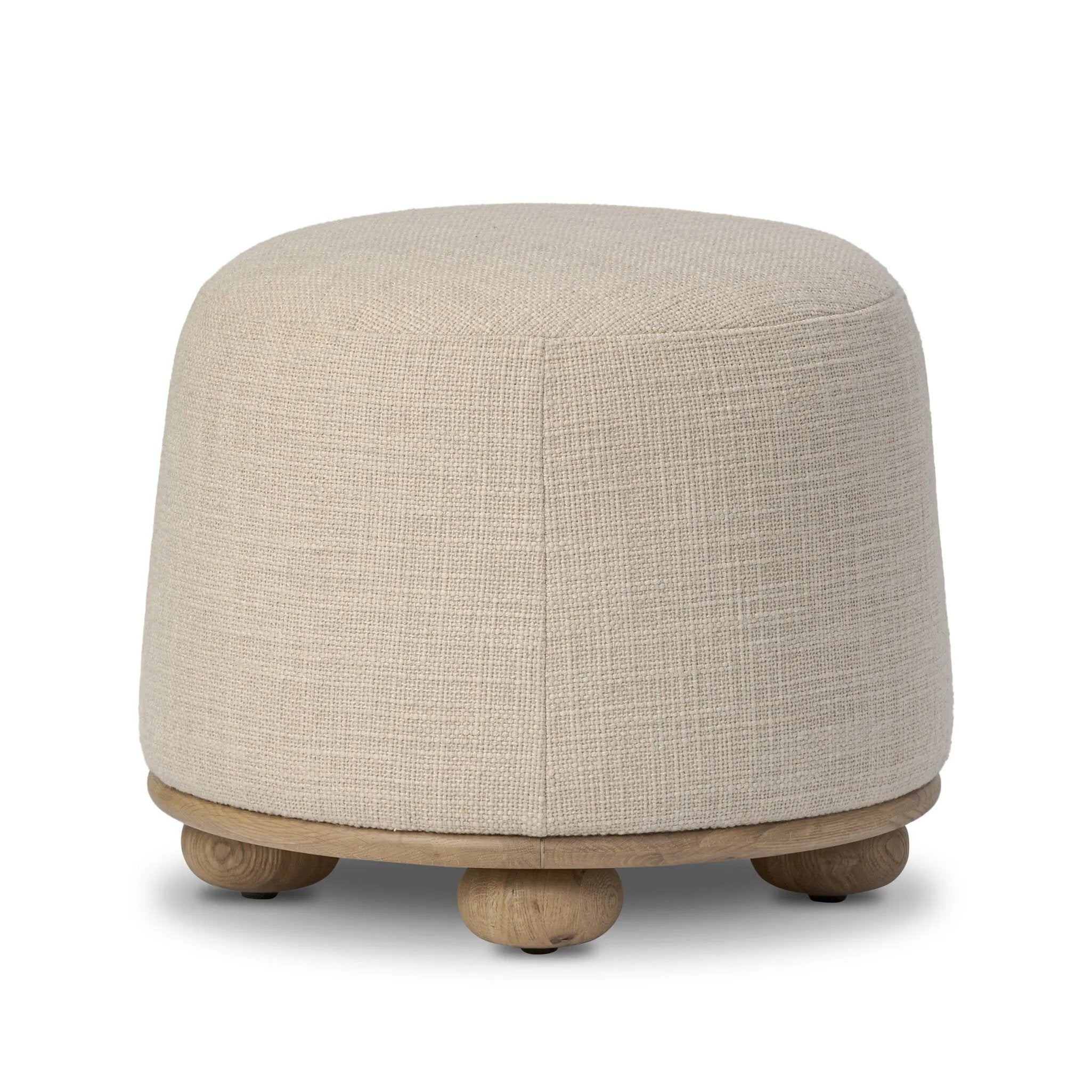 Featuring Bilbury Saxon Sand Ottoman by Four Hands at Amethyst Home. For an extra seat or propped feet, this welcoming ottoman features a subtly tapered shape and a rounded base with oak bun feet beneath. Crafted with soft foam cushioning and upholstered in a poly/wool blend fabric. Overall Dimensions: 22.00"w x 22.00"d x 18.50"h. Amethyst Home provides interior design, new home construction design consulting, vintage area rugs, and lighting in the Alpharetta metro area.