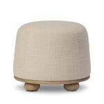Featuring Bilbury Saxon Sand Ottoman by Four Hands at Amethyst Home. For an extra seat or propped feet, this welcoming ottoman features a subtly tapered shape and a rounded base with oak bun feet beneath. Crafted with soft foam cushioning and upholstered in a poly/wool blend fabric. Overall Dimensions: 22.00"w x 22.00"d x 18.50"h. Amethyst Home provides interior design, new home construction design consulting, vintage area rugs, and lighting in the Houston metro area.