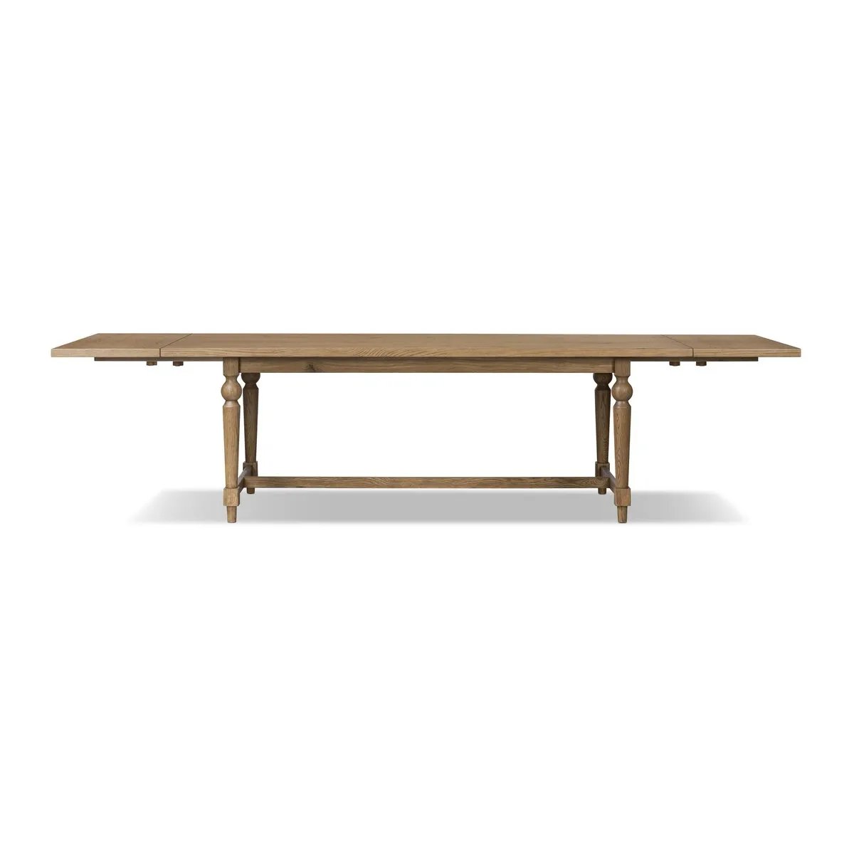 Featuring Blinn Worn Oak Veneer Extension Dining Table by Four Hands at Amethyst Home. Bring a traditional look to the dining room for parties large or small. A turned, tapered base of solid oak support a rectangular tabletop of oak veneer, with a warm, worn finish. On both ends, breadboard extensions provide the option to expand to fit up to 12 guests. Shi. Amethyst Home provides interior design, new home construction design consulting, vintage area rugs, and lighting in the Charlotte metro area.