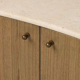 Fluid contours give shape to this solid mindi cabinet, topped with a creamy marbled top. Two doors with knobbed pulls open to inset shelves for organized storage Amethyst Home provides interior design, new home construction design consulting, vintage area rugs, and lighting in the Calabasas metro area.