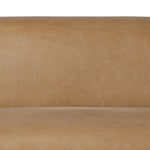 Meet modern comfort. Clean curves, impeccable tailoring and taupe top-grain leather with a pronounced grain bring an elevated, European-inspired look to this sofa Amethyst Home provides interior design, new home construction design consulting, vintage area rugs, and lighting in the Charlotte metro area.