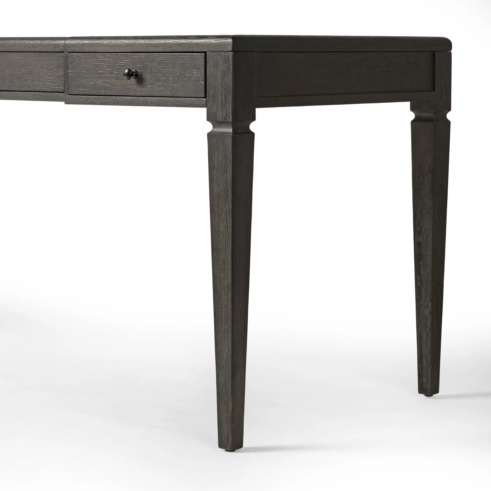 Featuring Claude Distressed Black Oak Veneer Desk by Four Hands at Amethyst Home. This refreshed directoire-style desk pairs a 100% top-grain leather inset top with a unique reverse breakfront and recessed center drawer. Finished in distressed black oak, it offers the workspace a classic yet updated feel.
Overall Dimensions: 28.0" L x 68.0 " W x 30.0" H
Materi. Amethyst Home provides interior design, new home construction design consulting, vintage area rugs, and lighting in the Austin metro area.