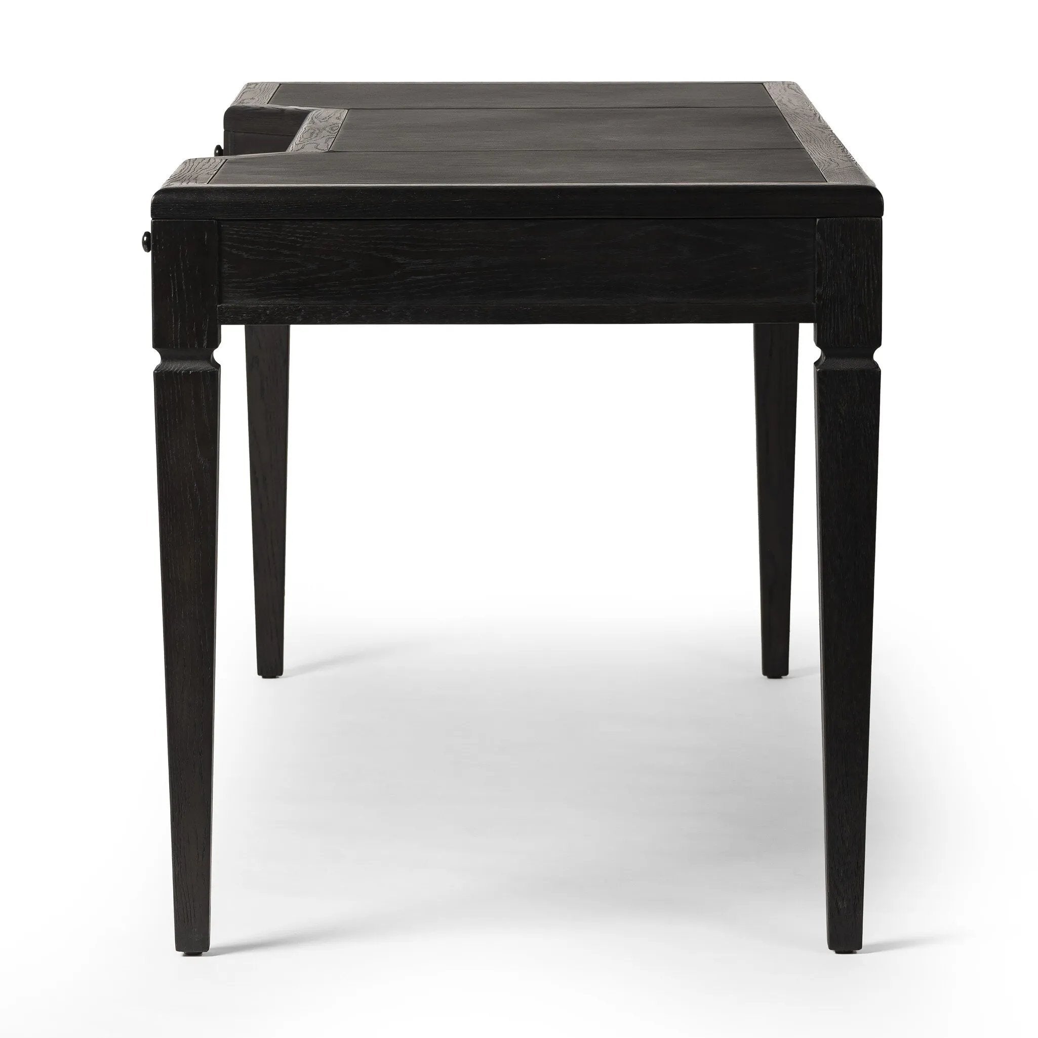 Featuring Claude Distressed Black Oak Veneer Desk by Four Hands at Amethyst Home. This refreshed directoire-style desk pairs a 100% top-grain leather inset top with a unique reverse breakfront and recessed center drawer. Finished in distressed black oak, it offers the workspace a classic yet updated feel.
Overall Dimensions: 28.0" L x 68.0 " W x 30.0" H
. Amethyst Home provides interior design, new home construction design consulting, vintage area rugs, and lighting in the Laguna Beach metro area.