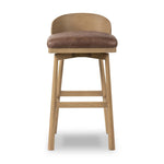 Featuring Cloris Palermo Cigar Swivel Bar + Counter Stool by Four Hands at Amethyst Home. Channel vintage vibes with a swivel stool perfectly sized for the bar. Crafted of blonde-finished oak, a low, molded back adds a playful touch, while a top-grain leather seat offers luxe comfort. Finished off with a memory swivel to ensure the stool's curved wood back sta. Amethyst Home provides interior design, new home construction design consulting, vintage area rugs, and lighting in the Dallas metro area.