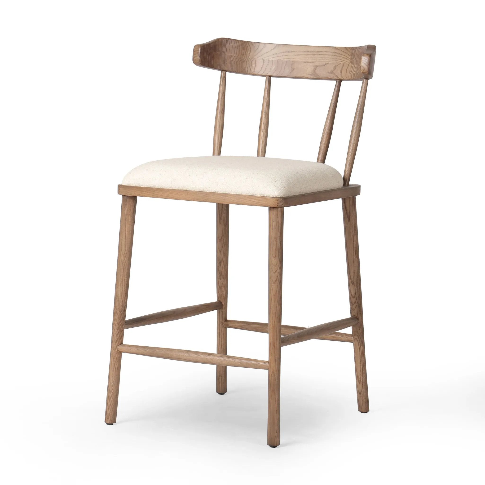 Featuring Colter Antwerp Natural Counter Stool by Four Hands at Amethyst Home. Made from solid ash with an amber finish, this versatile counter stool pairs an airy back with tapered spindles, for a simple, inviting look. A fixed upholstered seat of high-performance fabric adds a smart, comfortable touch. Steam regularly for a crisper fabric look. Perfo. Amethyst Home provides interior design, new home construction design consulting, vintage area rugs, and lighting in the Salt Lake City metro area.