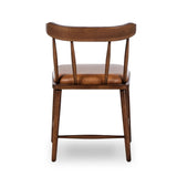 Featuring Colter Chaps Saddle Dining Chair by Four Hands at Amethyst Home. Made from solid ash with a vintage finish, this versatile dining chair pairs an airy back with tapered spindles, for a simple, inviting look. Fixed upholstered seat of top-grain leather adds a fresh, comfortable touch.Overall Dimensions: 20.50"w x 23.25"d x 31.25"hWeight : 13.01 l. Amethyst Home provides interior design, new home construction design consulting, vintage area rugs, and lighting in the Laguna Beach metro area.