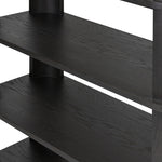 Unexpected contours give this bookcase its warm, modern vibe. Crafted oak veneer with a worn black finish, rounded legs are inset from the shelves with a plinth-like effect Amethyst Home provides interior design, new home construction design consulting, vintage area rugs, and lighting in the Dallas metro area.