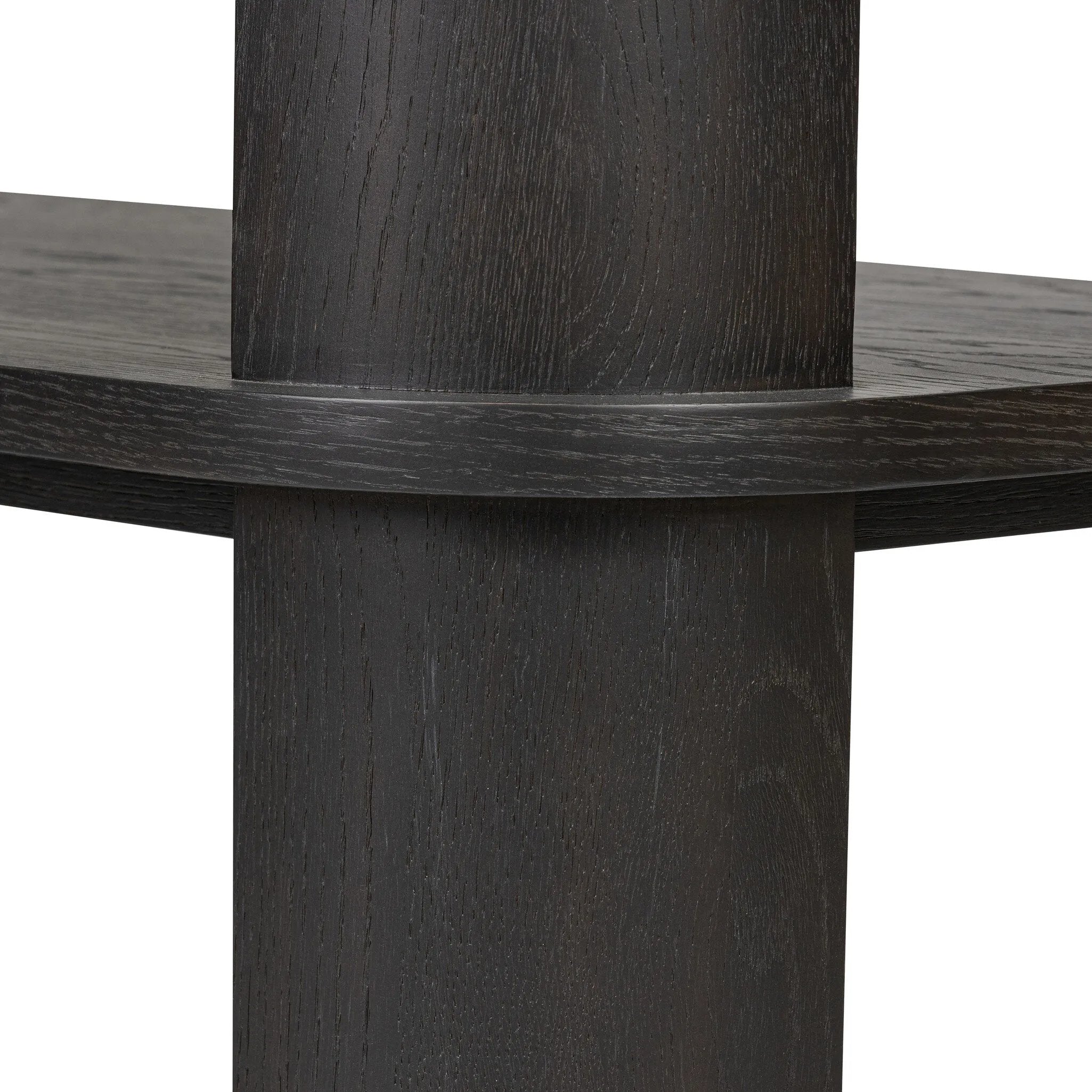 Unexpected contours give this bookcase its warm, modern vibe. Crafted oak veneer with a worn black finish, rounded legs are inset from the shelves with a plinth-like effect Amethyst Home provides interior design, new home construction design consulting, vintage area rugs, and lighting in the Los Angeles metro area.