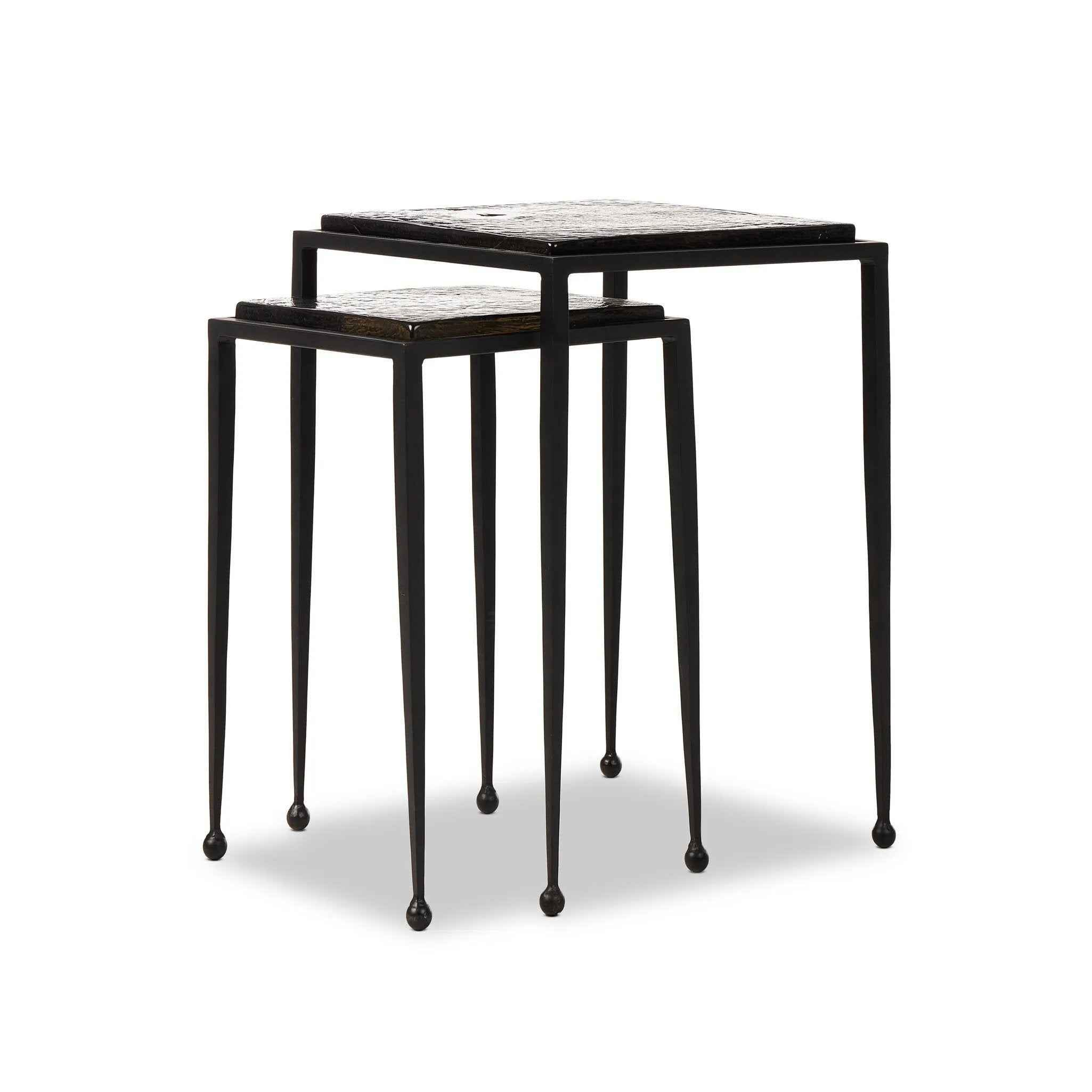 Featuring Dexter Smoked Black Cast Glass Nesting Tables by Four Hands at Amethyst Home. Embrace the mysterious with the Dexter smoked glass nesting tables.  Beautiful smoked glass gives a warm modern vibe while being practical.Overall Dimensions: 16.25"w x 16.25"d x 21.00"hWeight : 52.91 lbsMaterials : Cast Glass, Iron. Amethyst Home provides interior design, new home construction design consulting, vintage area rugs, and lighting in the Boston metro area.