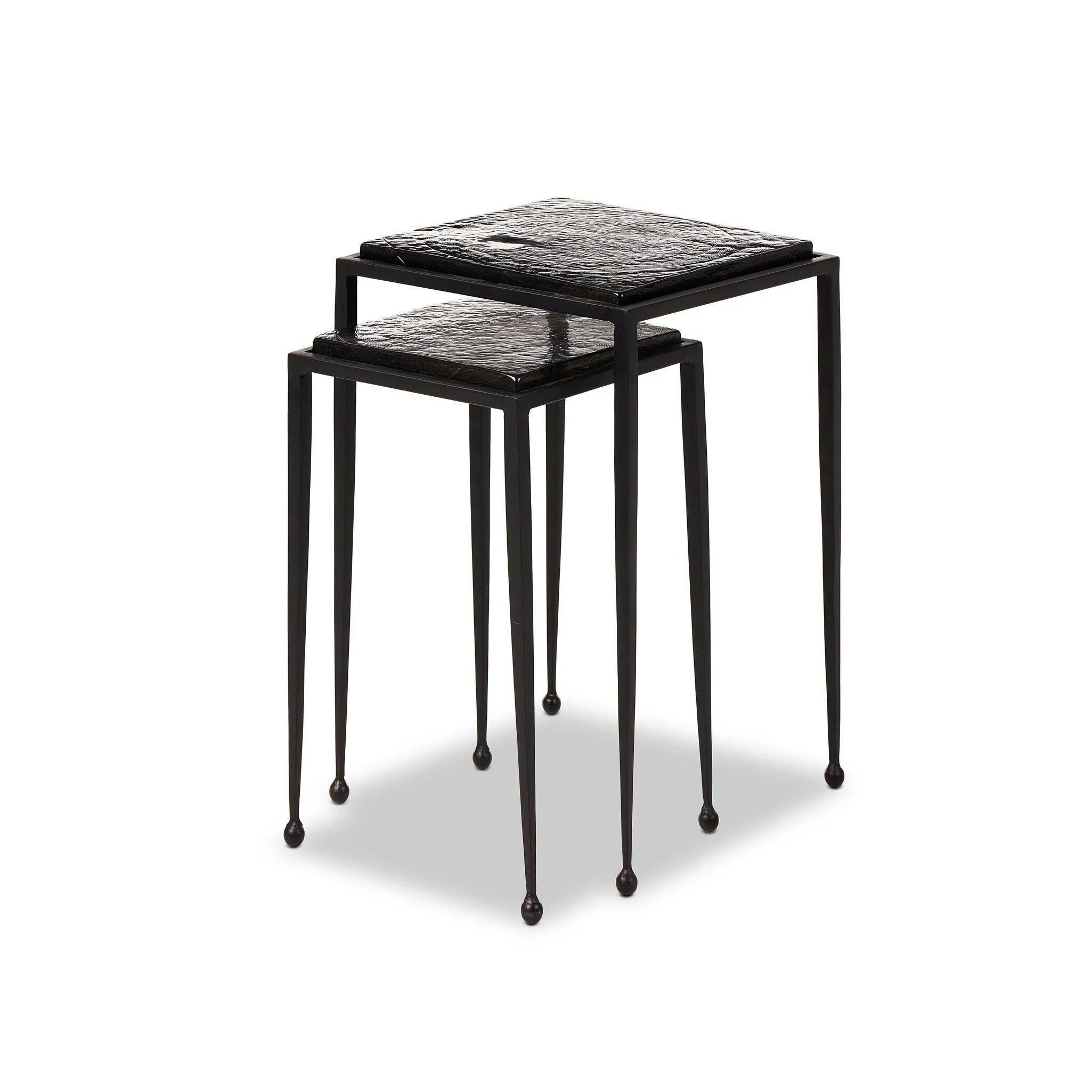 Featuring Dexter Smoked Black Cast Glass Nesting Tables by Four Hands at Amethyst Home. Embrace the mysterious with the Dexter smoked glass nesting tables.  Beautiful smoked glass gives a warm modern vibe while being practical.Overall Dimensions: 16.25"w x 16.25"d x 21.00"hWeight : 52.91 lbsMaterials : Cast Glass, Iron. Amethyst Home provides interior design, new home construction design consulting, vintage area rugs, and lighting in the Tampa metro area.