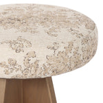 Large angular panels merge to form a geometrically inspired base in this modern counter stool. The circle metal ring around the base serves as a footrest, while the round upholstered cushion provides comfortable seating. The 360-degree swivel function adds versatility, and the combination of wood, metal, and fabric evoke a mixed material moment Amethyst Home provides interior design, new home construction design consulting, vintage area rugs, and lighting in the Dallas metro area.