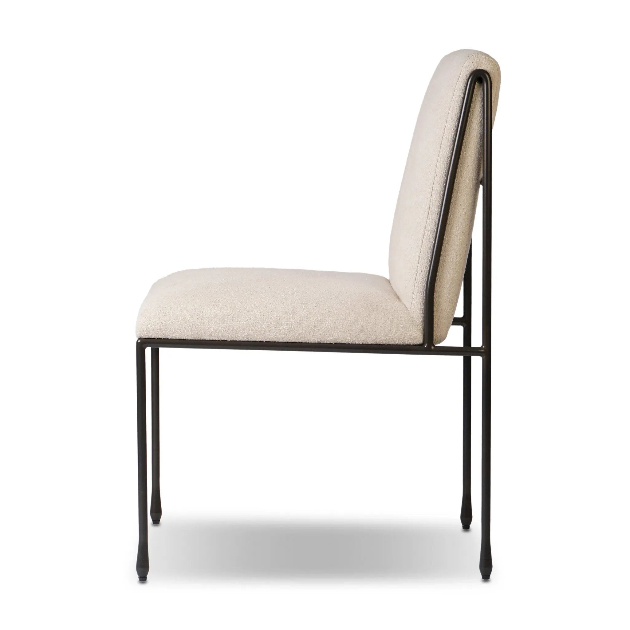 European inspiration gives streamlined character to this high-back metal-framed dining chair. Bent metal detail and tapered f