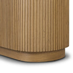 Crafted from light oak with a plinth-style base, rounded sides and linear reeding, this tall cabinet works subtle midcentury vibes into any space. Fully finished interior and shelves for quality detailing inside and out Amethyst Home provides interior design, new home construction design consulting, vintage area rugs, and lighting in the Winter Garden metro area.