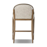 A tribute to traditional artistry and found pieces, this bar stool fluidly combines ash and burnished brass to frame a comfortable S-spring seat. Finished in heavy boucle-like upholstery that features a subtle linear pattern for added depth — creating a luxe, inviting feel. A design collaboration by Amber Lewis and Four Hands. Amethyst Home provides interior design, new home construction design consulting, vintage area rugs, and lighting in the Newport Beach metro area.